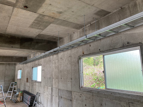 We constructed a ceiling-mounted RC cable rack (a silver ladder-like device for wiring that hangs from the ceiling).