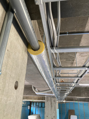 Installing exposed drain pipes for air conditioners with insulation material