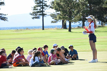 Paige Spiranac teaching children the basics of golf