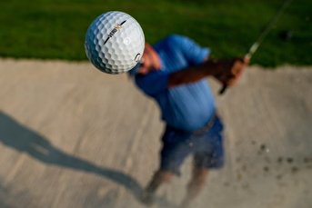 Chipping out of the bunker with a new iron shaft