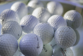 A bucket of golf balls