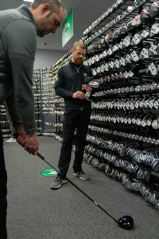 Trying out a Cobra driver in our golf superstore