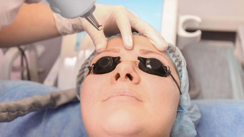 Lady having her eyebrow tattoo removed