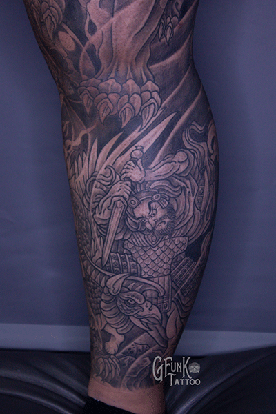  calf tattoo of a samurai