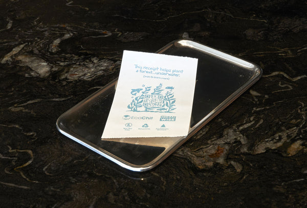 EcoChit label with Seaforestation graphic, on silver platter