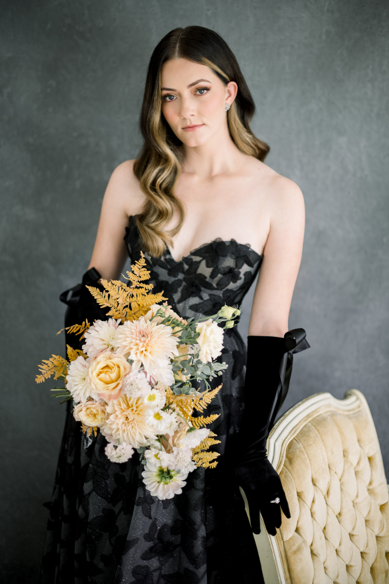 Model wears black wedding dress in a magazine photoshoot.