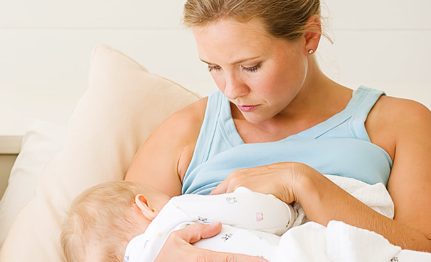 A mom is breastfeeding her baby
