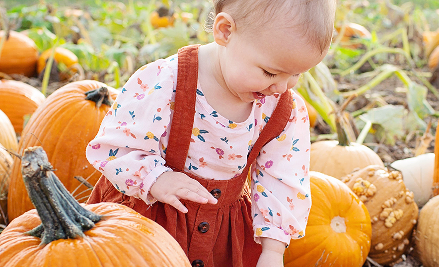 Baby in the pumpkin patch