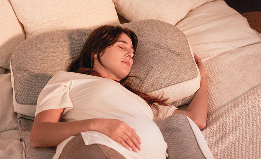 Mom sleeps with a momcozy pregnancy pillow