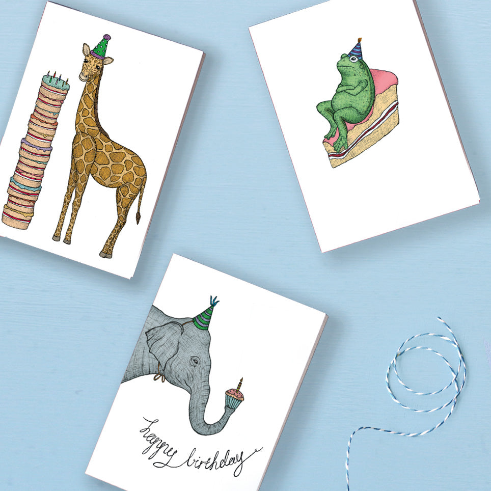 three animal birthday cards on blue background