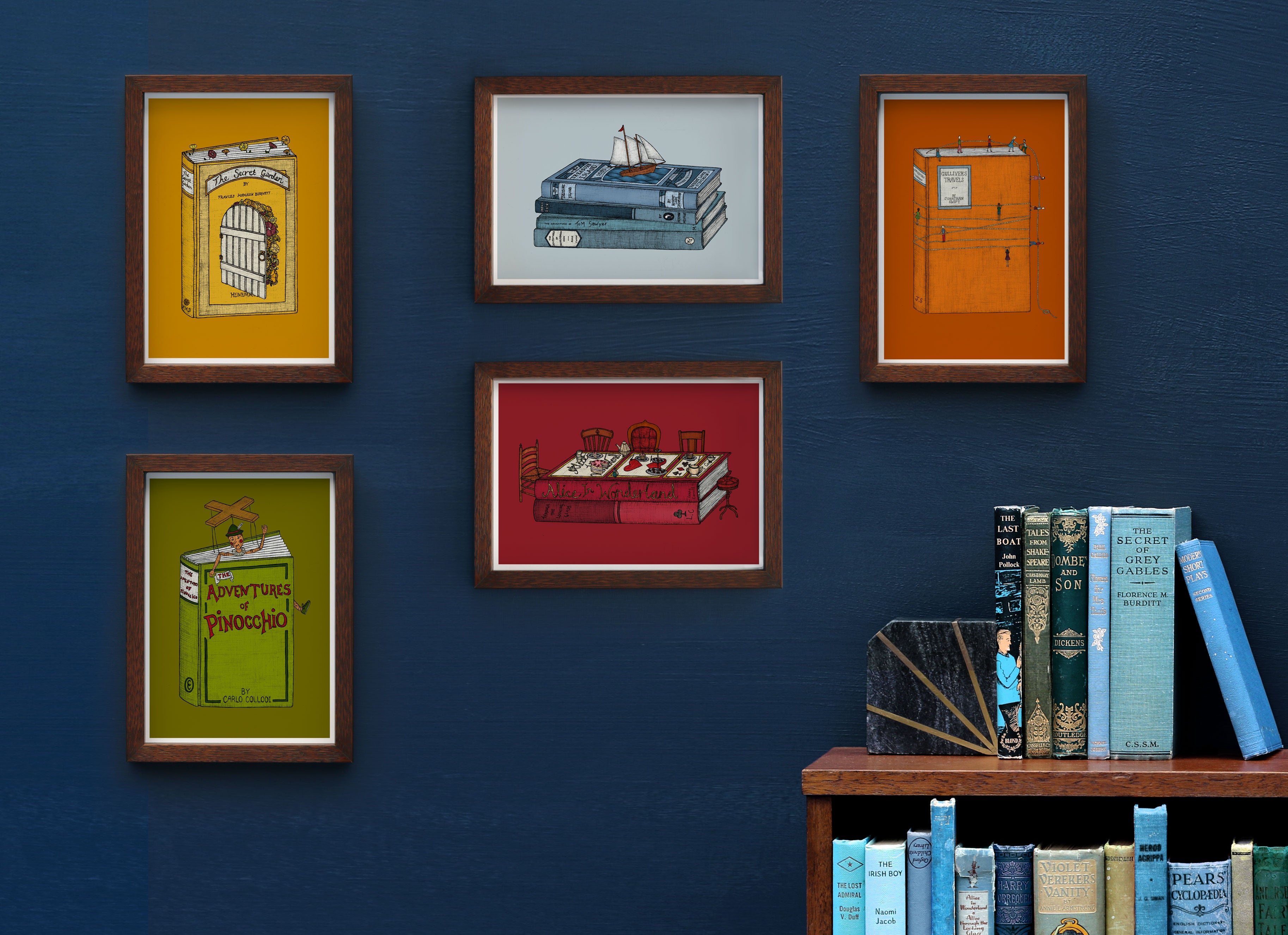 A5 art prints framed on a blue wall