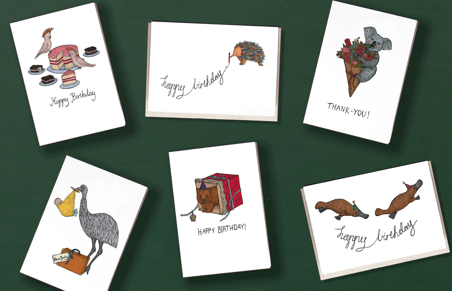 six handmade Australian themed greeting cards on a green background