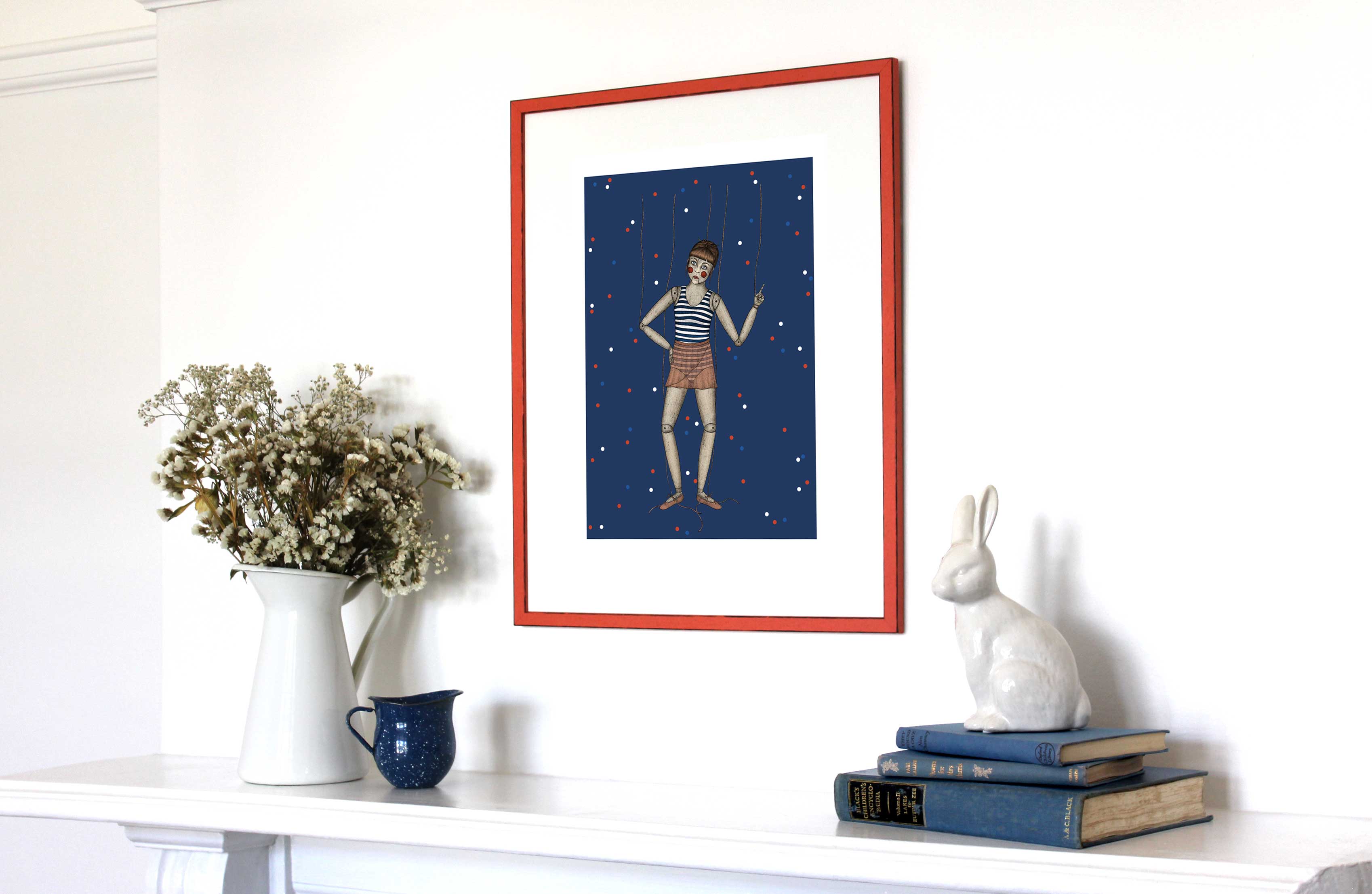 Art print in an orange frame hanging above a mantle.
