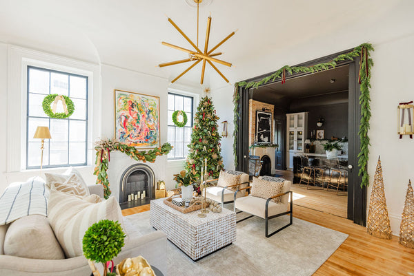 modern coastal style living room and moody kitchen decorated for Christmas