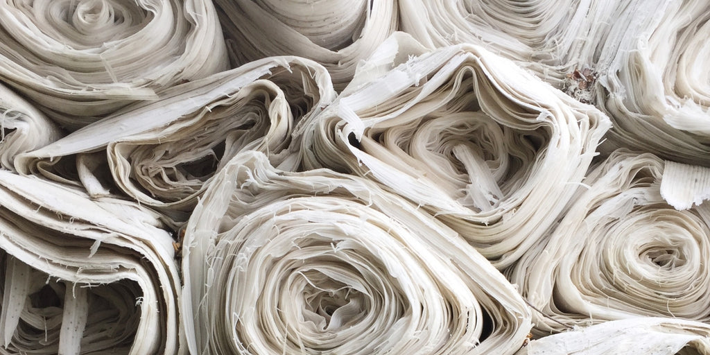 rolls of white cotton fabric