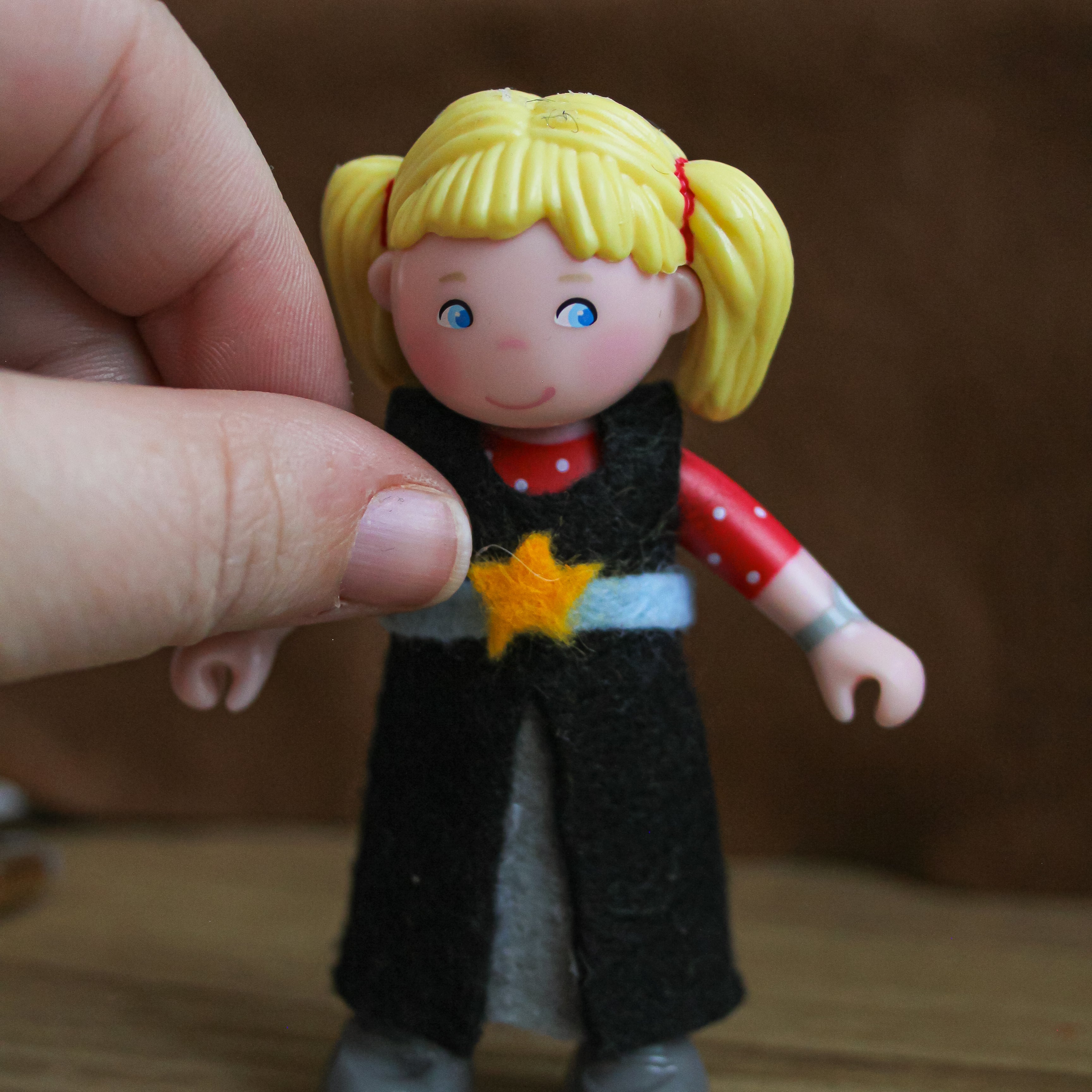 A star is being added to the front of a felted dress.