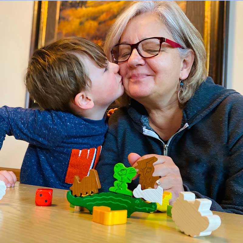 A family is playing HABA Animal upon Animal.