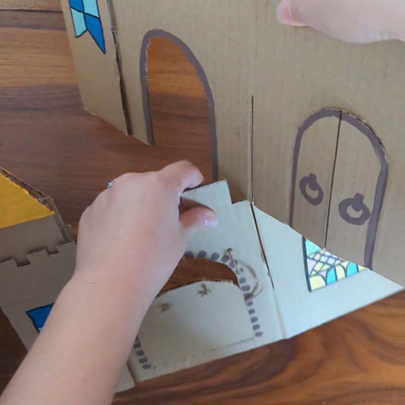 Two pieces of cardboard in the form of a castle.