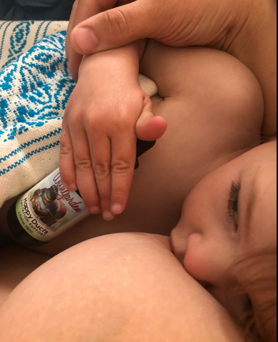 Breastfeeding baby with Happy Ducts herbal tincture