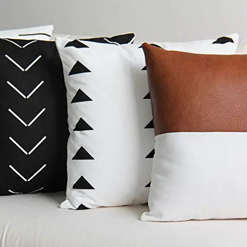 https://cdn.shopify.com/s/files/1/0559/3897/3850/products/Set-of-4-Modern-Faux-Leather-Modern-Throw-Pillow-Covers_-18-x18----Cream_-Brown_-Black-JOJUSIS-1667082343.jpg?v=1667082344&width=533