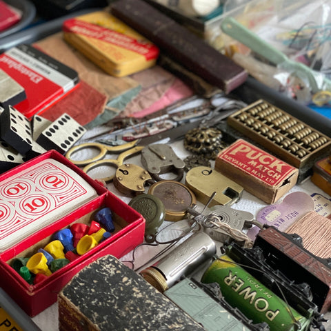 Trays of colourful antique and vintage items