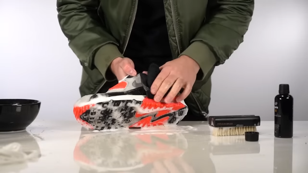 Wiping Air Max 90s with a Microfibre Towel