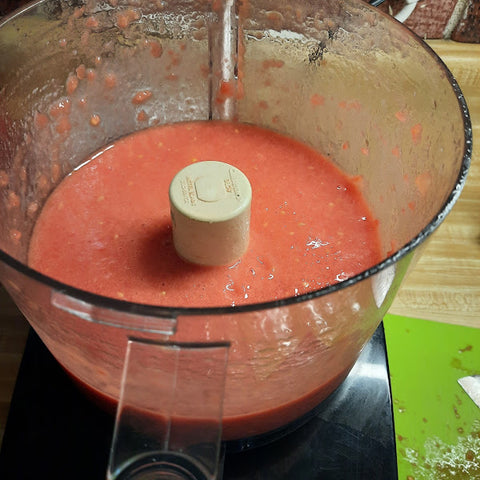 Pureed tomatoes in a food processor