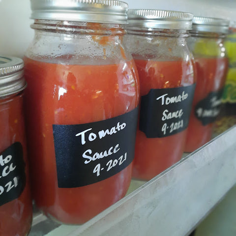 Jar and labeled tomato sauce in the freezer