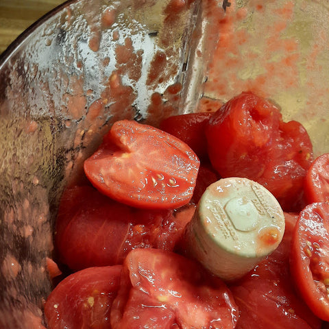 Cut fresh tomatoes in a food processor 