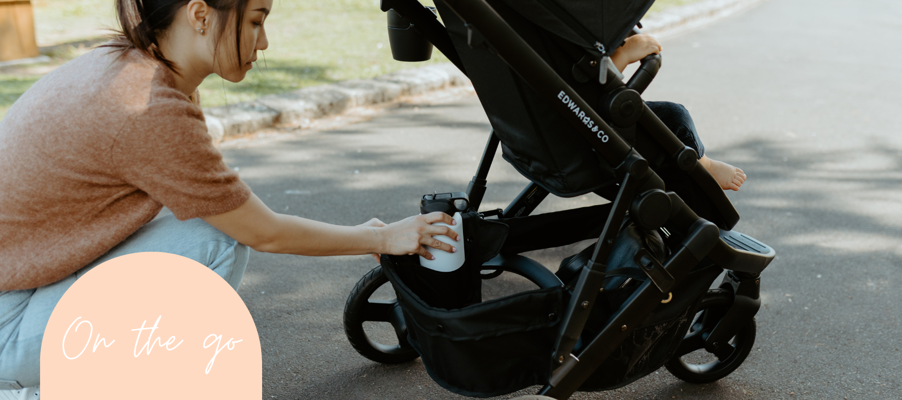 Mum packing a stroller for getting out and about with a baby