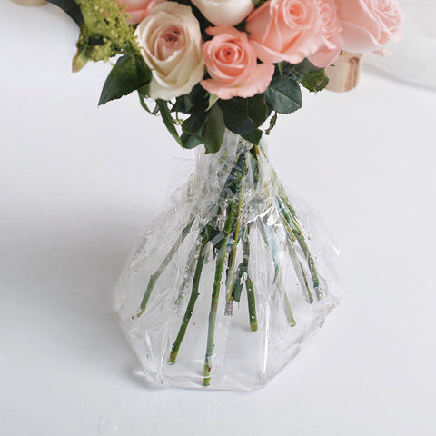 Rose Stems are wrapped by cellophane Paper