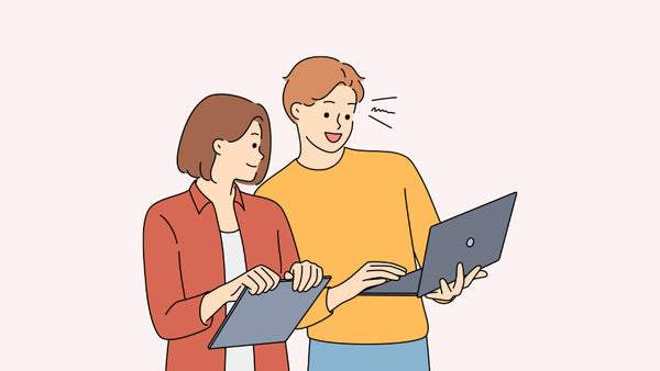 one guy and one girl in cartoon drawing looking at a laptop.