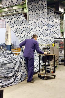 A man producing african wax facbric in Vlisco factory