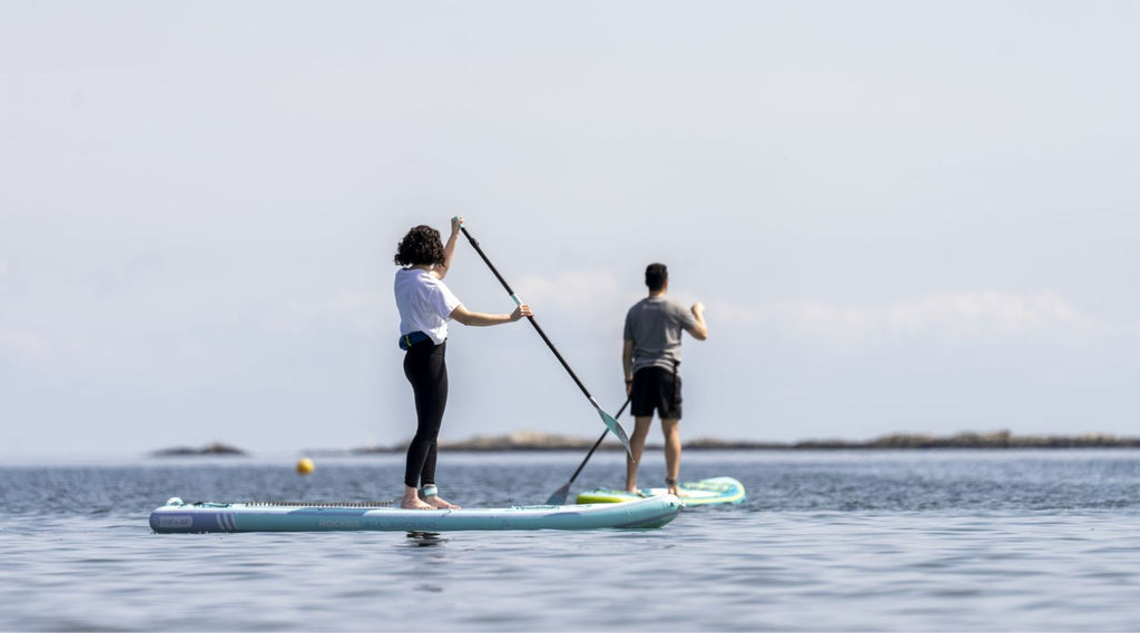 couple on paddle boards