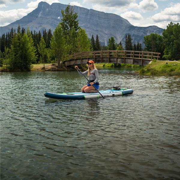 Woman riding BLACKFIN standup paddle board