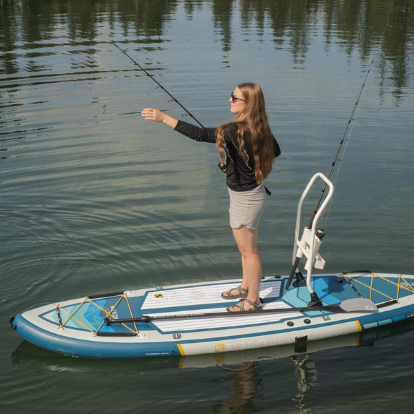 Woman fishing on BLACKFIN standup paddle board 