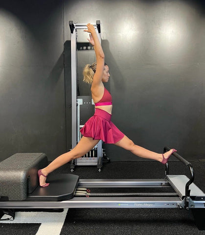 woman on pilates reformer