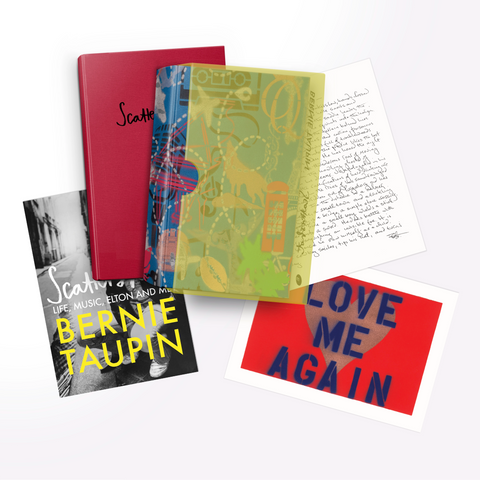 Three prints, a print wallet, and the book in it's yellow perspex slipcase lay arranged, slightly overlapping each other. The prints are: a facsimile reproduction of the epilogue of Scattershot, handwritten by Bernie Taupin; a limited edition of Bernie Taupin's 'Love Me Again' artwork, which features the words Love Me Again printed in bold blue capital letters, over a pinky-gold heart shape, on a bright red background; and the UK trade edition cover of Scattershot featuring a black and white portrait of Taupin, with the words "Scattershot, Life, Music, Elton and Me" and "BERNIE TAUPIN" overlaid.