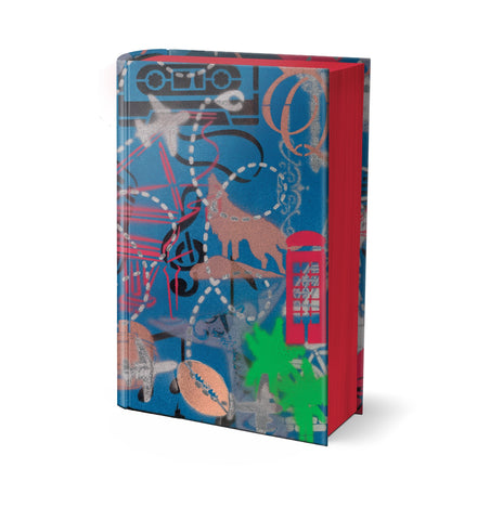 On a white background, a hardback special edition of Bernie Taupin's Scattershot stands upright. It's blue clothbound cover is designe dby Bernie and features illustrative motifs including planes, cassette tapes and treble clefs, phone boxes in bold reds, greens, greys and black.