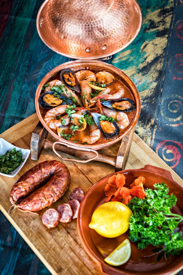 prawn and chorizo cataplana on a table