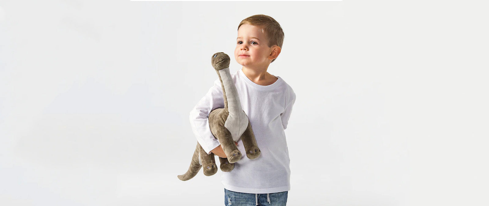 Enfant peluche dinosaure