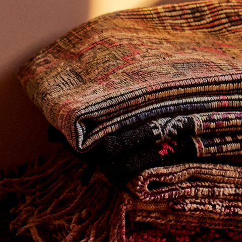 Stack of antique rugs