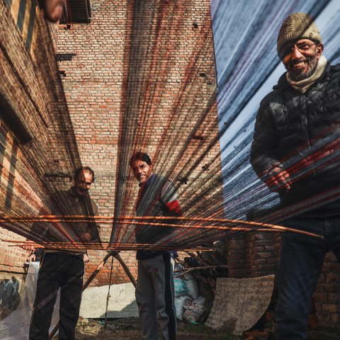 Men weaving cashmere fibers