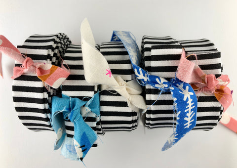 rolls of black and white quilt binding with fabric ties