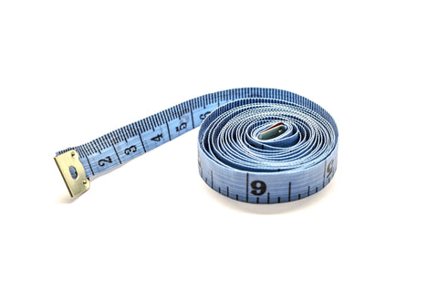 Blue tailors measuring tape curled around itself