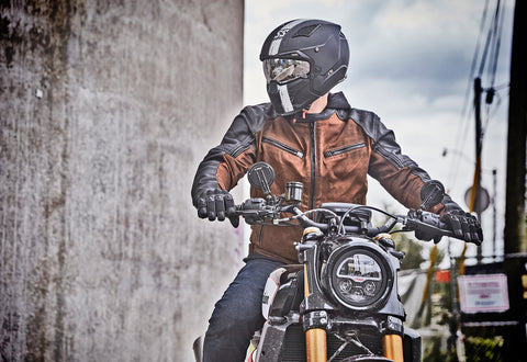 Motorcyclist wearing a vintage style motorcycle jacket