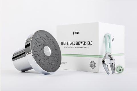 filtered showerhead sitting beside it's branded box