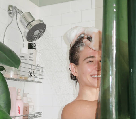 woman in shower using a fine hair treatment