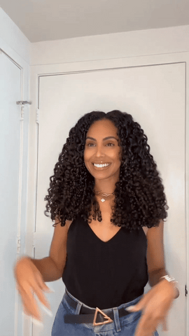 woman with enhanced curls from a curly hair shower routine