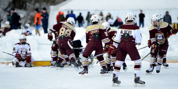 Image of additional kids playing hockey at the Youth Pond Hockey Tournament for the Laura Foundation.